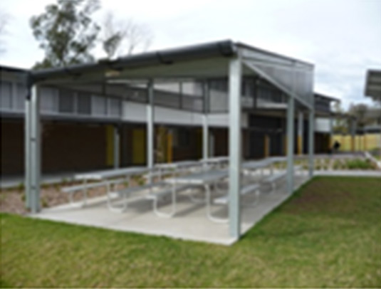 This photo shows an architectural strcutre which provides shade for seating. This photo was taken from the Hunter/Central Coast Region.