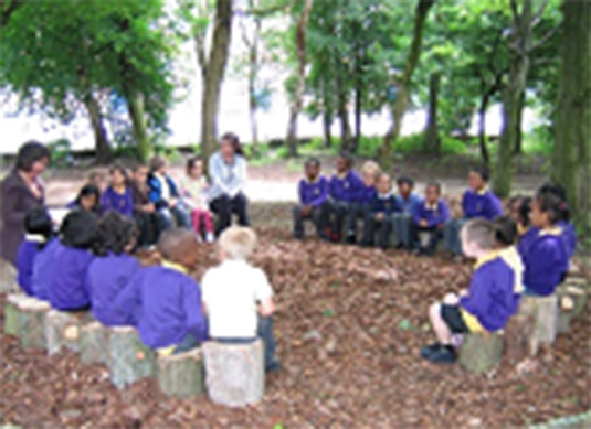 The photo shows an outdoor classroom. This photo was taken from Manchester. 