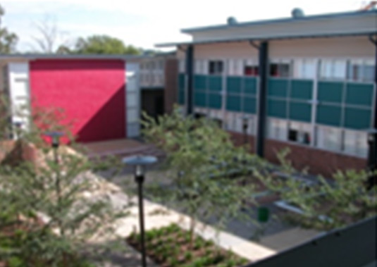 This photo shows how buildings can significantly overshadow outdoor spaces in winter, but provide little shade for lunch/recess in summer. The reverse is desirable. This photo is taken from South Western Sydney.