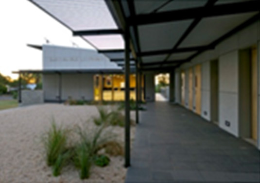 This photo shows a generous veranda providing shade and rain protection whilst reducing heat absorption by the buildings. It also provides a transition zone between internal and external areas. This photo was taken from Western New South Wales. 